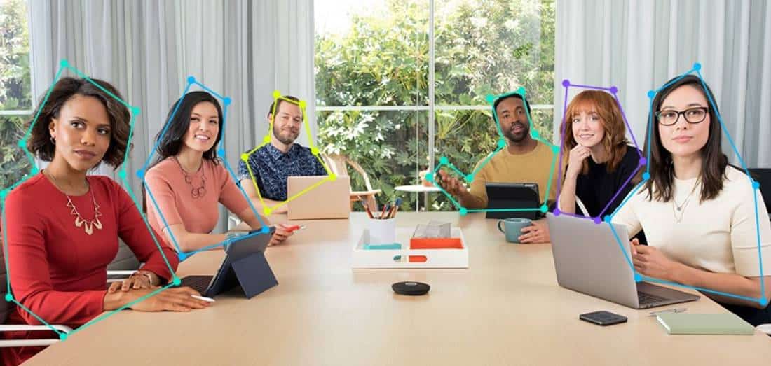 AV technology displaying a group of people sitting at a desk.